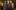 David Oyelowo, Rufus Norris and Andrew Garfield standing alongside each other, looking into the camera and smiling.
