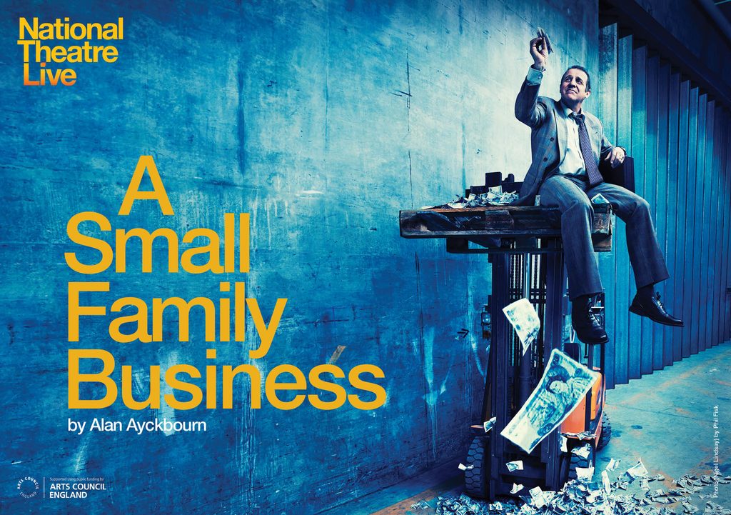 NTLive_ASmallFamilyBusiness_A5Landscape_Digi_200114 (1) A man wearing a suit sits on a tall table and flies a paper aeroplane of money as money falls around him.