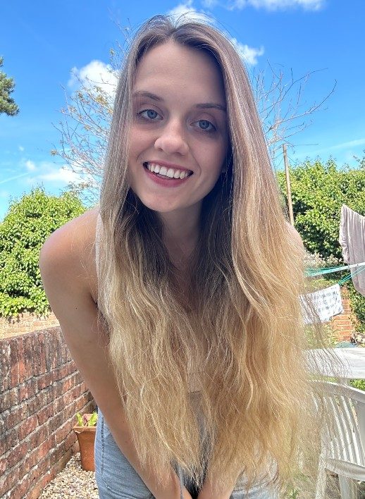 Ola-Klos-headshot-OlaKlos-518x708 A photograph of a person with very long blonde hair