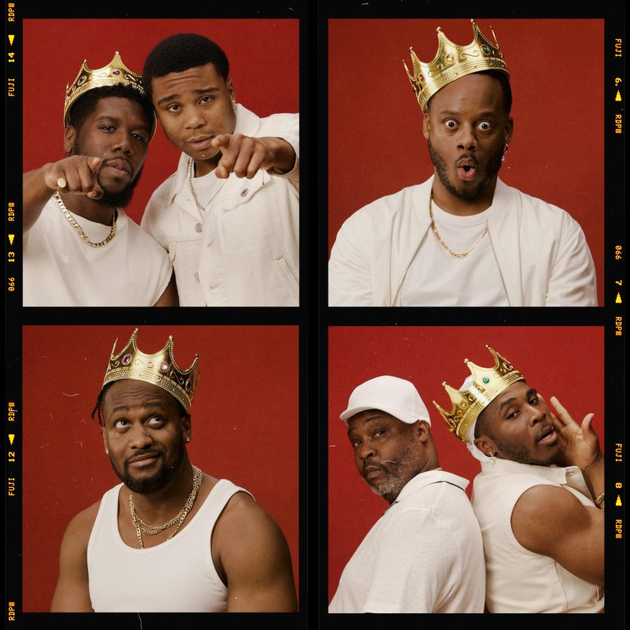 The-Hot-Wing-King-National-Theatre-masthead-v2 A series of six photos against a red backdrop featuring six men. In various shots, one drinks from a glass, one wears a crown, one adjusts the crown, one laughs with the crown, one looks surprised with the crown, and one poses in a white hat showing rings on his fingers.
