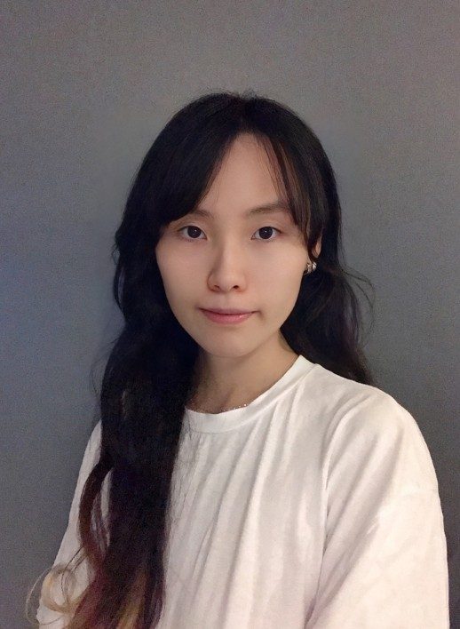 Yijing-Chen-headshot-YijingChen-518x708 A person with long, black hair wearing a long-sleeved white top