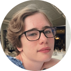 2022AimeeMatthews-circlecrop-YoungTechs A profile picture of a young person with short brown hair and dark glasses